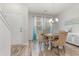 Elegant dining room with a round table, upholstered chairs, and stylish lighting at 310 Kiskadee Loop # D, Conway, SC 29526