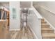 Welcoming hallway with durable wood-look floors, leading to staircase and other rooms in the home at 310 Kiskadee Loop # D, Conway, SC 29526