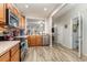 Well-equipped kitchen features stainless steel appliances, warm wood cabinetry, and spacious layout at 310 Kiskadee Loop # D, Conway, SC 29526