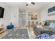 Open-concept living room showcases seamless flow into the kitchen, enhanced by modern flooring and ample natural light at 310 Kiskadee Loop # D, Conway, SC 29526