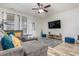 Comfortable living room featuring a sectional sofa, stylish rug, and ample natural light at 310 Kiskadee Loop # D, Conway, SC 29526