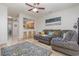 Open-concept living room with a view to the kitchen, complete with comfortable seating and stylish decor at 310 Kiskadee Loop # D, Conway, SC 29526
