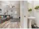 Cozy powder room is conveniently situated adjacent to the living room, featuring a pedestal sink at 310 Kiskadee Loop # D, Conway, SC 29526