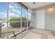 Inviting screened porch with outdoor seating, peaceful views of the pond, and access to the backyard at 310 Kiskadee Loop # D, Conway, SC 29526