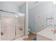 Full bathroom features a glass door shower and ample counter space, creating a clean and stylish space at 3104 Sweetwater Blvd. # 3104, Murrells Inlet, SC 29576