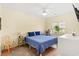 Bright bedroom featuring a queen bed, ceiling fan, and ample natural light, creating a cozy and inviting atmosphere at 3104 Sweetwater Blvd. # 3104, Murrells Inlet, SC 29576