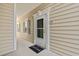 Inviting entryway featuring a 'Welcome' mat, stylish door with decorative trim, and a well-maintained exterior at 3104 Sweetwater Blvd. # 3104, Murrells Inlet, SC 29576