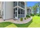 Charming exterior view featuring a screened-in porch and meticulously maintained landscaping at 3104 Sweetwater Blvd. # 3104, Murrells Inlet, SC 29576