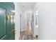Bright hallway with light blue walls, wood floors, and a view into other rooms, creating a welcoming space at 3104 Sweetwater Blvd. # 3104, Murrells Inlet, SC 29576