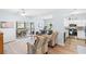 Inviting living room featuring a sliding glass door to a patio and an open layout flowing into the kitchen at 3104 Sweetwater Blvd. # 3104, Murrells Inlet, SC 29576