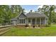 Backyard featuring a screened-in porch and outdoor seating area at 3180 Long Avenue Ext., Conway, SC 29526