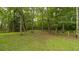 A beautiful spacious backyard surrounded by lush greenery and mature trees at 3180 Long Avenue Ext., Conway, SC 29526