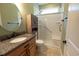 Bathroom features a vanity with granite countertop and a walk-in shower with safety bars at 3180 Long Avenue Ext., Conway, SC 29526
