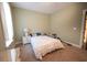 A bedroom features a large bed, a nightstand, and bright natural light at 3180 Long Avenue Ext., Conway, SC 29526