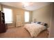 A bedroom features a large bed, two large windows, and bright natural light at 3180 Long Avenue Ext., Conway, SC 29526