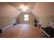 A bonus room has a ceiling fan, neutral carpet, and a window that provides natural light at 3180 Long Avenue Ext., Conway, SC 29526
