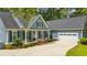 Charming home featuring blue siding, white trim, and a spacious driveway at 3180 Long Avenue Ext., Conway, SC 29526