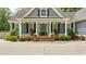 Inviting front porch with classic columns and brick steps at 3180 Long Avenue Ext., Conway, SC 29526