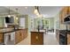 Bright eat-in kitchen with stainless steel appliances, an island, and a backyard view at 3180 Long Avenue Ext., Conway, SC 29526