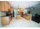 This kitchen features wooden cabinets, a black stove top, and stainless-steel appliances at 3180 Long Avenue Ext., Conway, SC 29526