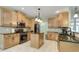 Charming kitchen boasts wooden cabinets, black appliances, and granite countertops at 3180 Long Avenue Ext., Conway, SC 29526