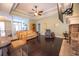 Open living room features a ceiling fan, a mounted television, and a fireplace at 3180 Long Avenue Ext., Conway, SC 29526
