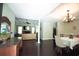Open-concept living spaces with hardwood floors, a stone fireplace, and a modern kitchen at 3180 Long Avenue Ext., Conway, SC 29526