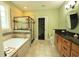 Relaxing main bathroom with a glass enclosed shower, soaking tub, and wooden vanity at 3180 Long Avenue Ext., Conway, SC 29526
