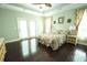 Spacious main bedroom boasts tray ceilings, wood floors, and French doors to the outside at 3180 Long Avenue Ext., Conway, SC 29526