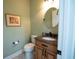 Cozy powder room features granite countertops, a modern faucet, and vanity with storage at 3180 Long Avenue Ext., Conway, SC 29526