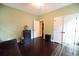 A versatile room has hardwood floors and natural light from two windows at 3180 Long Avenue Ext., Conway, SC 29526