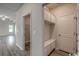 Well-organized mudroom with built-in bench and storage cabinets at 331 Garden Grove St, Conway, SC 29526