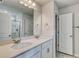 Bathroom featuring double sink vanity with white countertops, a large mirror, and a tile floor at 335 Garden Grove St, Conway, SC 29526