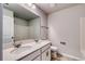 Bathroom featuring double sink vanity, large mirror, and tiled floors at 335 Garden Grove St, Conway, SC 29526