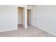 View of the neutral bedroom with carpet, an open closet and an open door to another room at 335 Garden Grove St, Conway, SC 29526
