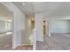 Upstairs hallway leading to bedrooms features plush carpeting and a staircase at 335 Garden Grove St, Conway, SC 29526