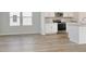 Open-concept kitchen featuring stainless steel appliances and a center island at 335 Garden Grove St, Conway, SC 29526