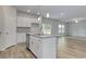 Open kitchen features a center island with a sink and eat-in bar seating at 335 Garden Grove St, Conway, SC 29526