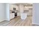 Open kitchen features a stainless steel appliance package and island with sink at 335 Garden Grove St, Conway, SC 29526