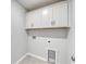 Laundry room has white cabinets, tiled floors and utility connections at 335 Garden Grove St, Conway, SC 29526