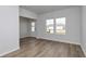 The living room features wood flooring, white walls, and a bright front door at 335 Garden Grove St, Conway, SC 29526