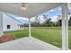 The covered patio provides a relaxing view of the green lawn and trees at 335 Garden Grove St, Conway, SC 29526