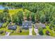 Aerial view of a home with lush green trees surrounding the property, with a nice lawn at 340 Boxcar Dr., Longs, SC 29568