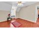 A bright bedroom with a ceiling fan, window seat, and hardwood floors at 340 Boxcar Dr., Longs, SC 29568