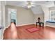 Spacious bedroom showcasing a window seat, ceiling fan, and hardwood flooring at 340 Boxcar Dr., Longs, SC 29568
