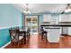 Open dining area with hardwood floors and direct access to outdoor patio at 340 Boxcar Dr., Longs, SC 29568