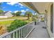 A welcoming front porch showcasing lush landscaping and charming neighborhood views at 340 Boxcar Dr., Longs, SC 29568