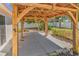 A wooden gazebo with a concrete patio, and landscaping in the backyard at 340 Boxcar Dr., Longs, SC 29568