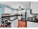Bright kitchen featuring white cabinets, stainless steel appliances, and a stylish backsplash at 340 Boxcar Dr., Longs, SC 29568