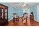 Open-concept living room features a china cabinet and comfortable seating at 340 Boxcar Dr., Longs, SC 29568